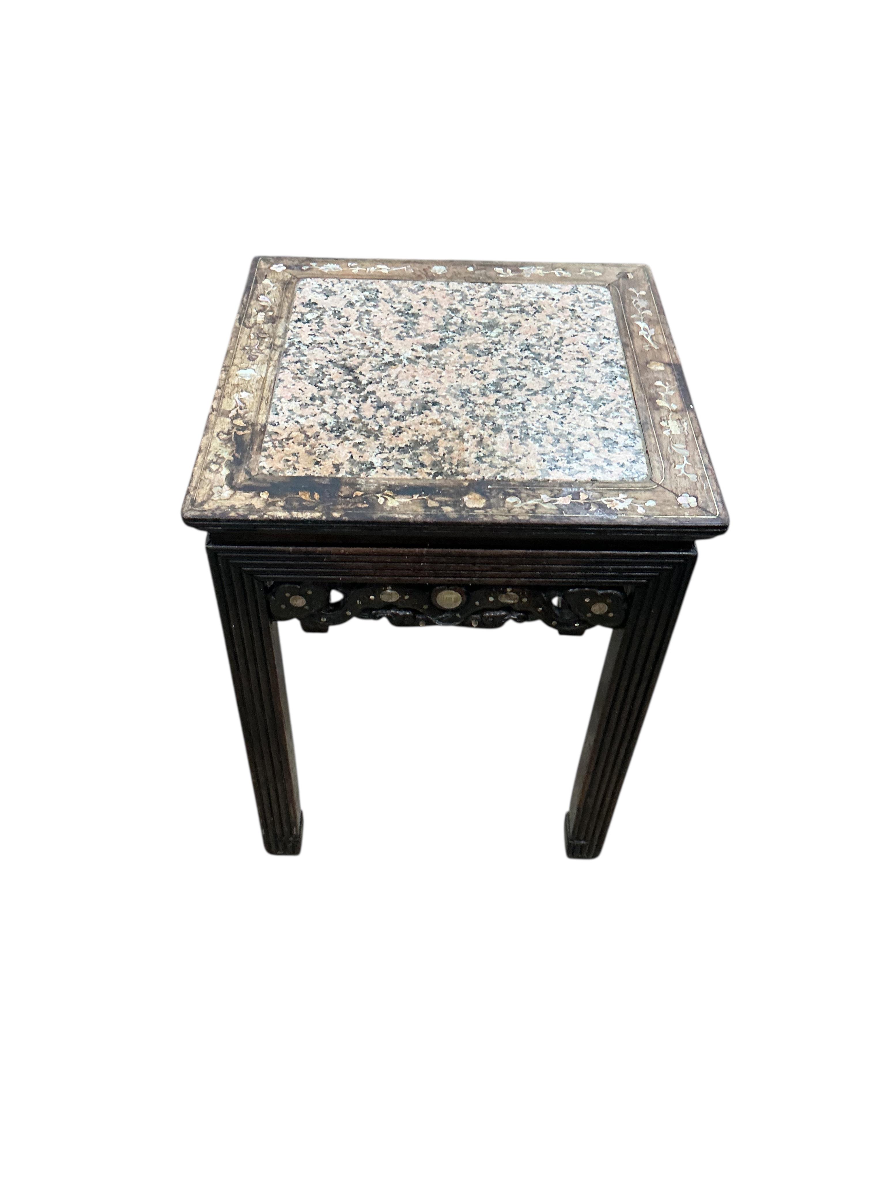 A late 19th century Chinese rosewood and mother of pearl inlaid marble top vase stand, width 41cm, height 52cm
